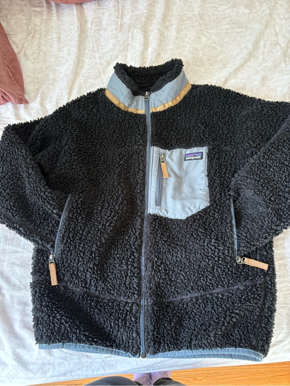 Patagonia Kids Black Sherpa Jacket with Light Gray Chest Pocket and Tan Trim